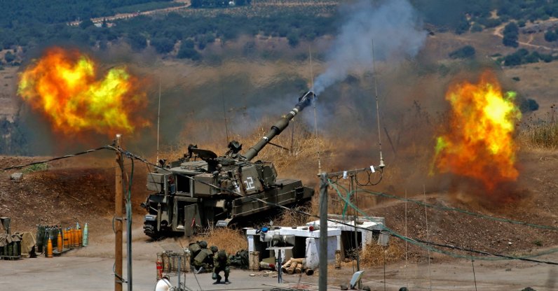 Israeli self-propelled howitzers fire toward Lebanon from a position near Kiryat Shmona, northern Israel, Aug. 6, 2021. (AFP Photo)