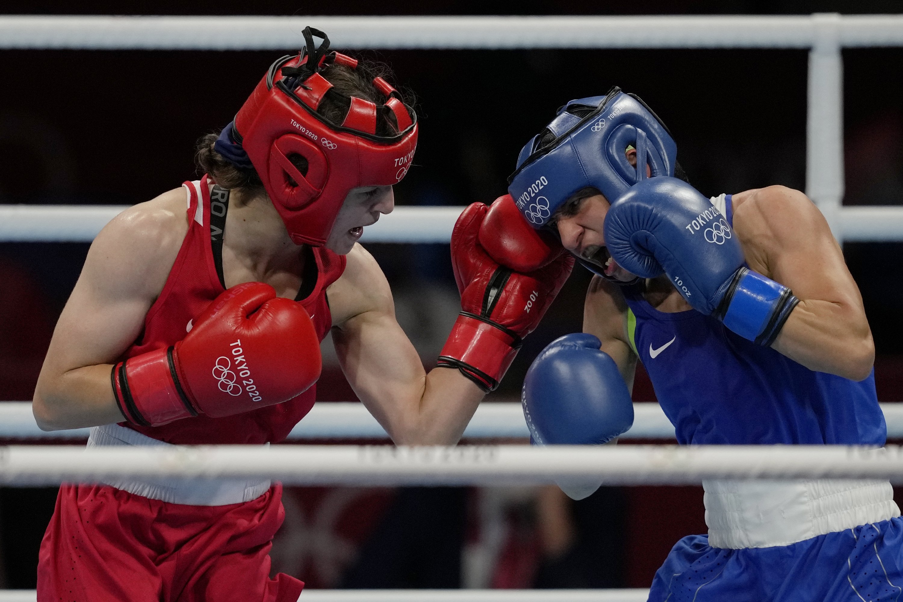 Turkey's Buse Naz Çakıroğlu (L), exchanges punches with Bulgaria's Stoyka Krasteva (R) during their women's flyweight 51-kg boxing gold medal match at the 2020 Summer Olympics, in Tokyo, Japan, Aug. 7, 2021. (AP Photo)