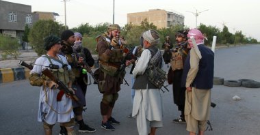 Private militia loyal to Ismail Khan, the former Mujahideen commander, talks with each others and patrols after security forces took back control of parts of Herat city following fighting between Taliban and Afghan security forces in Herat province, west of Kabul, Afghanistan, Aug. 6, 2021. (AP Photo)