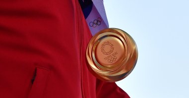 Archer Mete Gazoz of Turkey wears his gold medal at the Yumenoshima Archery Field in Tokyo, Japan, July 31, 2021. (Reuters Photo)