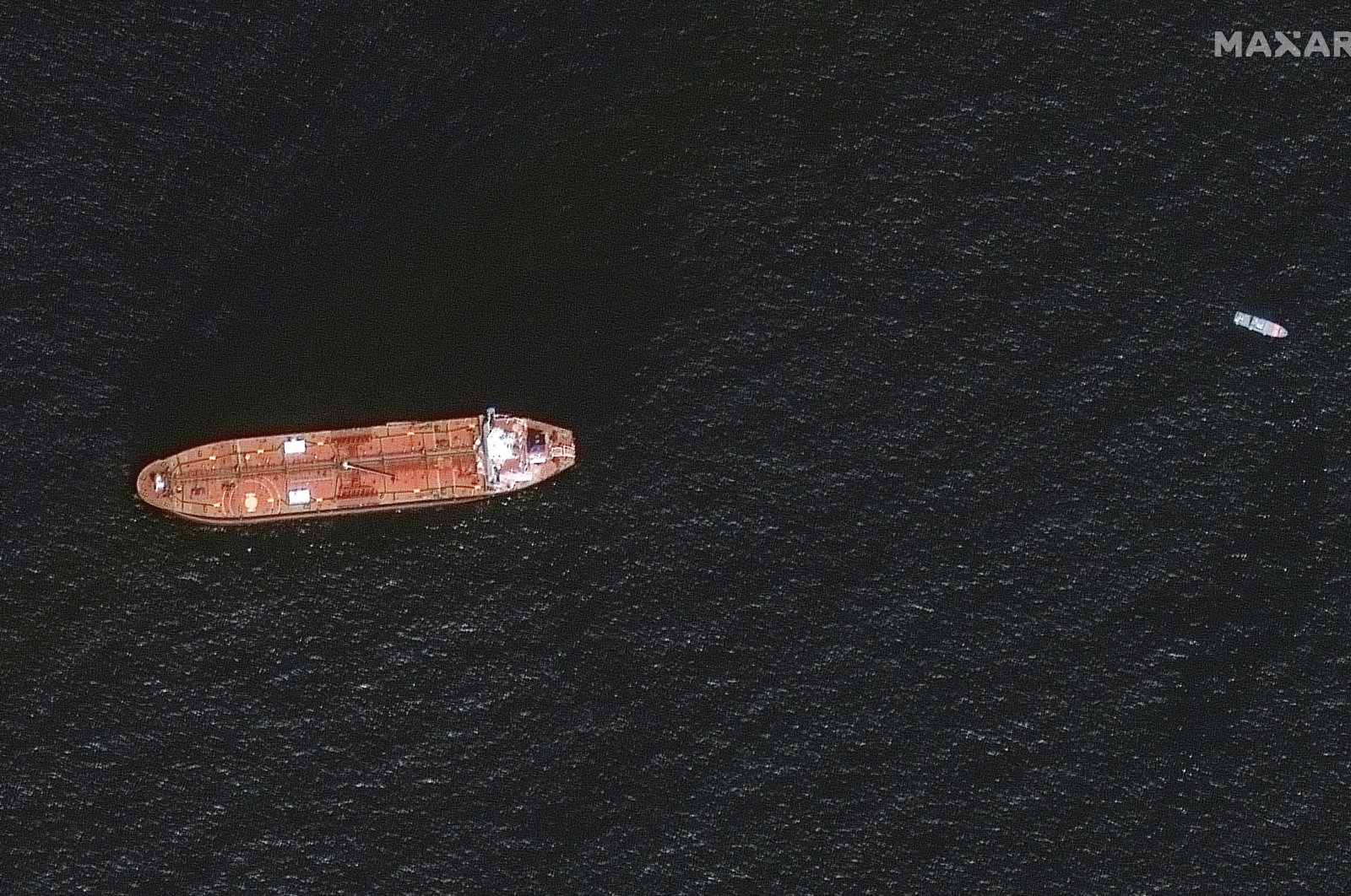 A satellite image shows the damaged Mercer Street Tanker moored off the coast of Fujairah, United Arab Emirates, Aug. 4, 2021. (Maxar Technologies via Reuters)