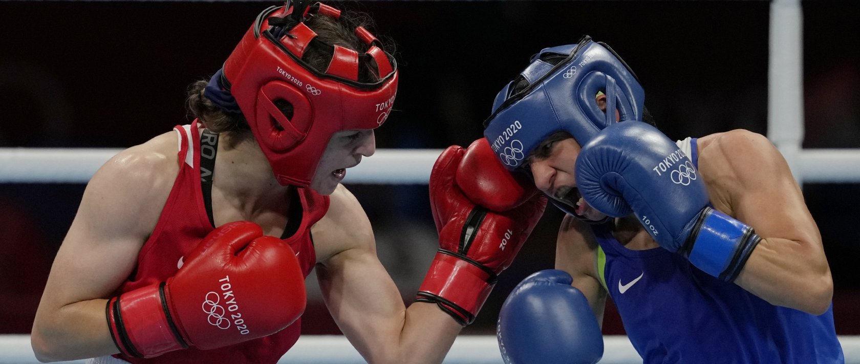 Turkey's Buse Naz Çakıroğlu, left, exchanges punches with Bulgaria's Stoyka Krasteva during their women's flyweight 51-kg boxing gold medal match at the 2020 Summer Olympics, Aug. 7, 2021, in Tokyo, Japan. (AP Photo)