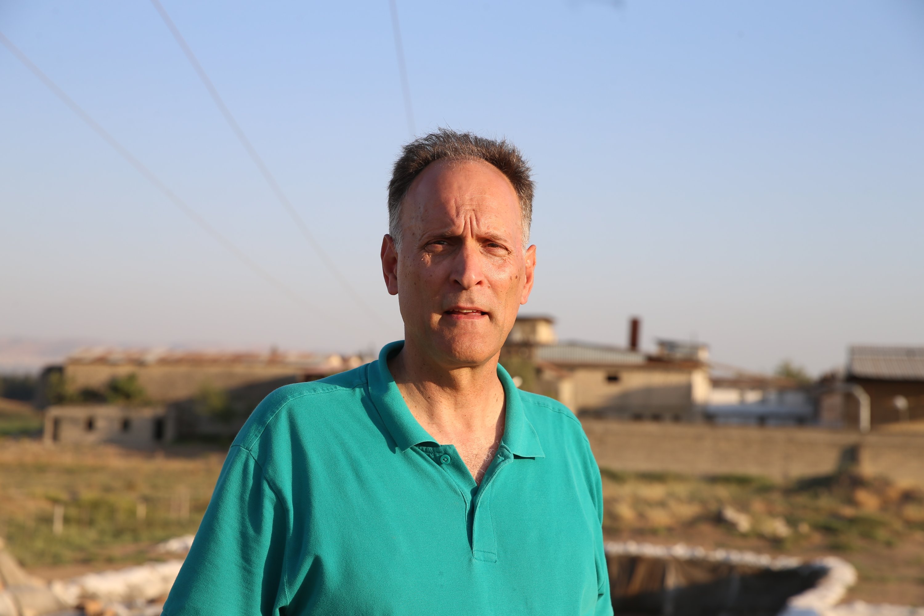 Professor Timothy Harrison poses in Tell Tayinat, Hatay, southern Turkey, August 8, 2021. (AA Photo) 