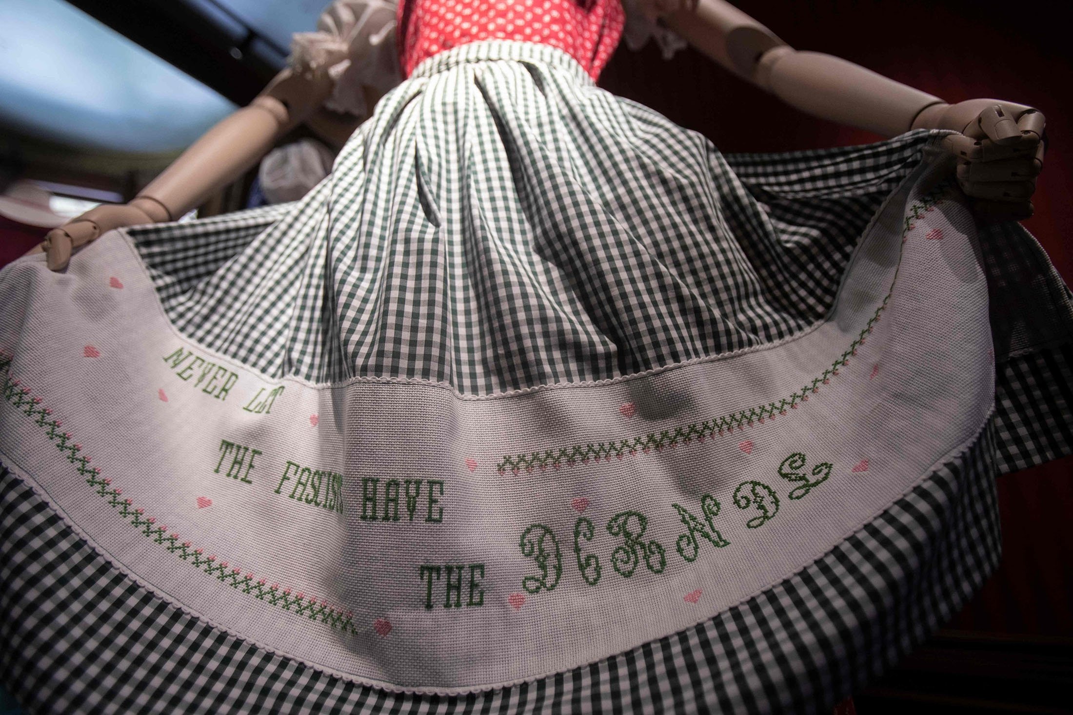 A dirndl dress with the stitched lettering "Never let the fascists have the DIRNDL" is on display at the exhibition "Dirndl – Tradition goes fashion" at the Mamorschloessl palace in Bad Ischl, Upper Austria, June 24, 2021. (AFP Photo)