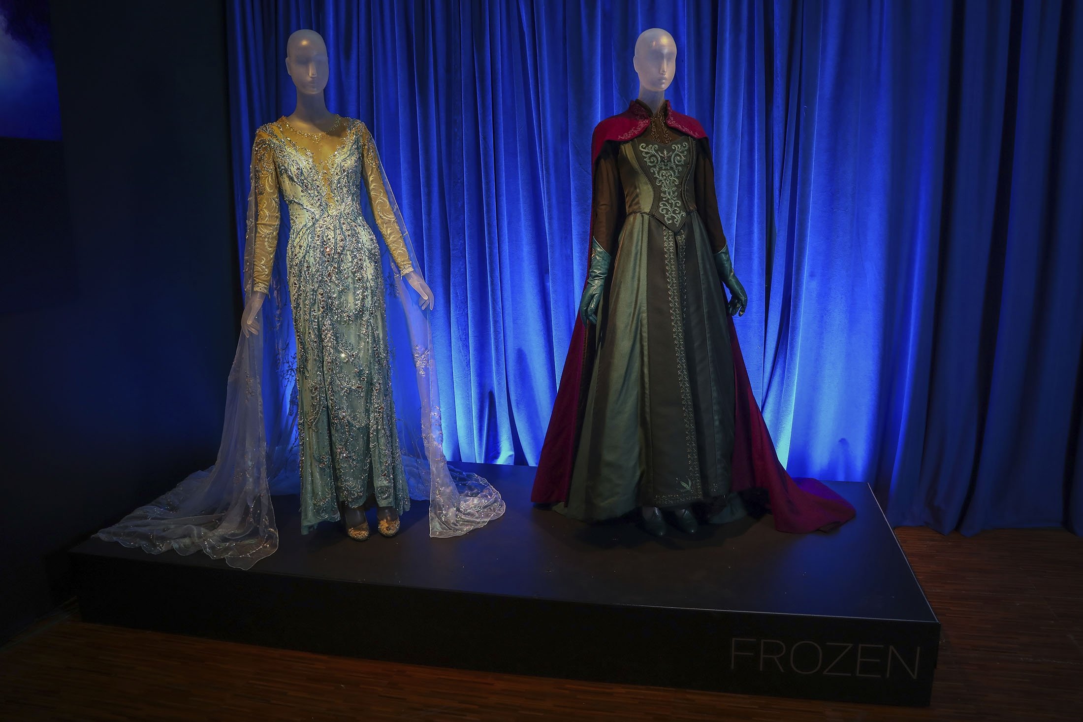 Costumes from the Broadway musical "Frozen" are displayed at the "Showstoppers! Spectacular Costumes from Stage & Screen" exhibit in Times Square, New York, U.S., Aug. 2, 2021. (AP Photo)