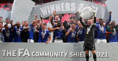 Leicester City's Kasper Schmeichel and teammates celebrate with the FA Community Shield trophy after beating Manchester City at the Wembley Stadium, London, England, Aug. 7, 2021.