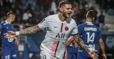 Paris Saint-Germain's Argentinian forward Mauro Icardi celebrates after scoring a goal during the French Ligue 1 match against Troyes at the Stade de l'Aube in Troyes, France, Aug. 7, 2021. (AFP Photo)