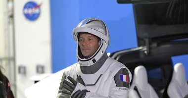 European Space Agency astronaut Thomas Pesquet of France, adjusts his glove as he talks to family and friends before a launch attempt at the Kennedy Space Center in Cape Canaveral, Fla., April 23, 2021. (AP File Photo)