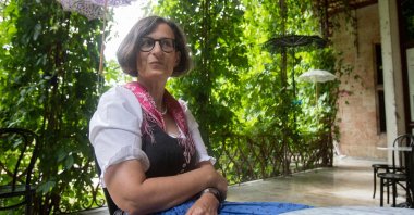 Thekla Weissengruber, curator of the exhibition "Dirndl – Tradition goes fashion" on display at the Mamorschloessl palace in Bad Ischl, Upper Austria, poses for a photo, June 24, 2021. (AFP Photo)