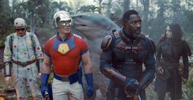 David Dastmalchian (L), John Cena (C-L), Idris Elba (C-R) and Daniela Melchoir walk through a jungle setting in a scene from the film "The Suicide Squad." (Warner Bros. Pictures via AP)