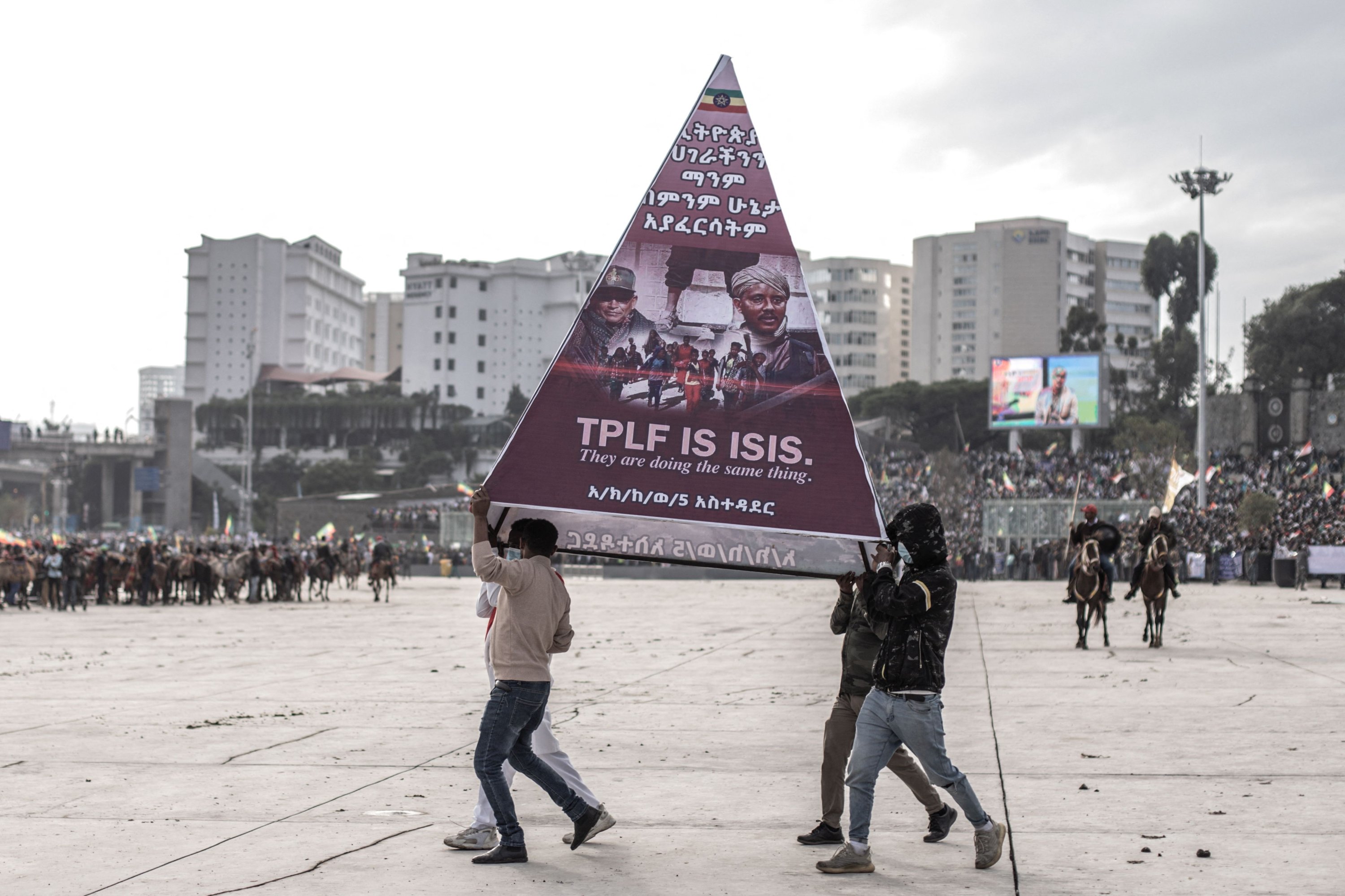 Protesters carry a banner during a rally against TPLF forces (Tigray People's Liberation Front) and in support of Ethiopia's armed forces in Addis Ababa on Aug. 8, 2021. (AFP Photo)