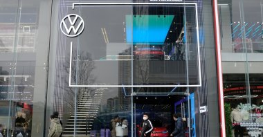 People walk past a showroom of SAIC Volkswagen in Chengdu, Sichuan province, China, Jan. 10, 2021. (Reuters Photo)