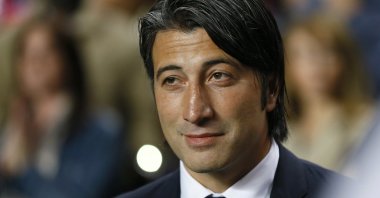 Then-Basel coach Murat Yakın watches his team warm up before a Champions League group E match against Chelsea at Stamford Bridge, London, England, Sept. 18, 2013. (AP Photo)