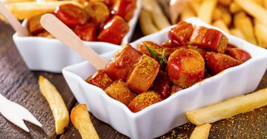 Traditional German currywurst, served with fries. (Shutterstock Photo)