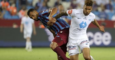 Molde's Ohi Omoijuanfo (R) duels for the ball with Trabzonspor's Vitor Hugo during the Europa Conference League qualifying match at Yeni Stadium, Trabzon, Turkey, Aug. 5, 2021. (AP Photo)