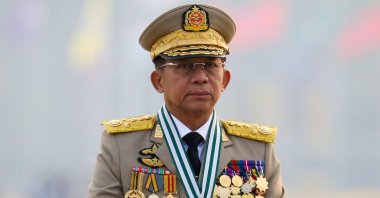 Myanmar's junta chief, Senior Gen. Min Aung Hlaing, who ousted the elected government in a coup on Feb. 1, presides over an army parade on Armed Forces Day in Naypyitaw, Myanmar, March 27, 2021. (Reuters File Photo)