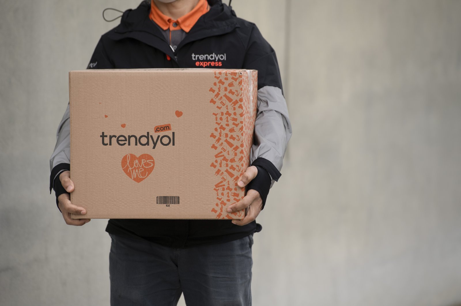 A Trendyol worker holds a package in this undated photo. (Courtesy of Trendyol)