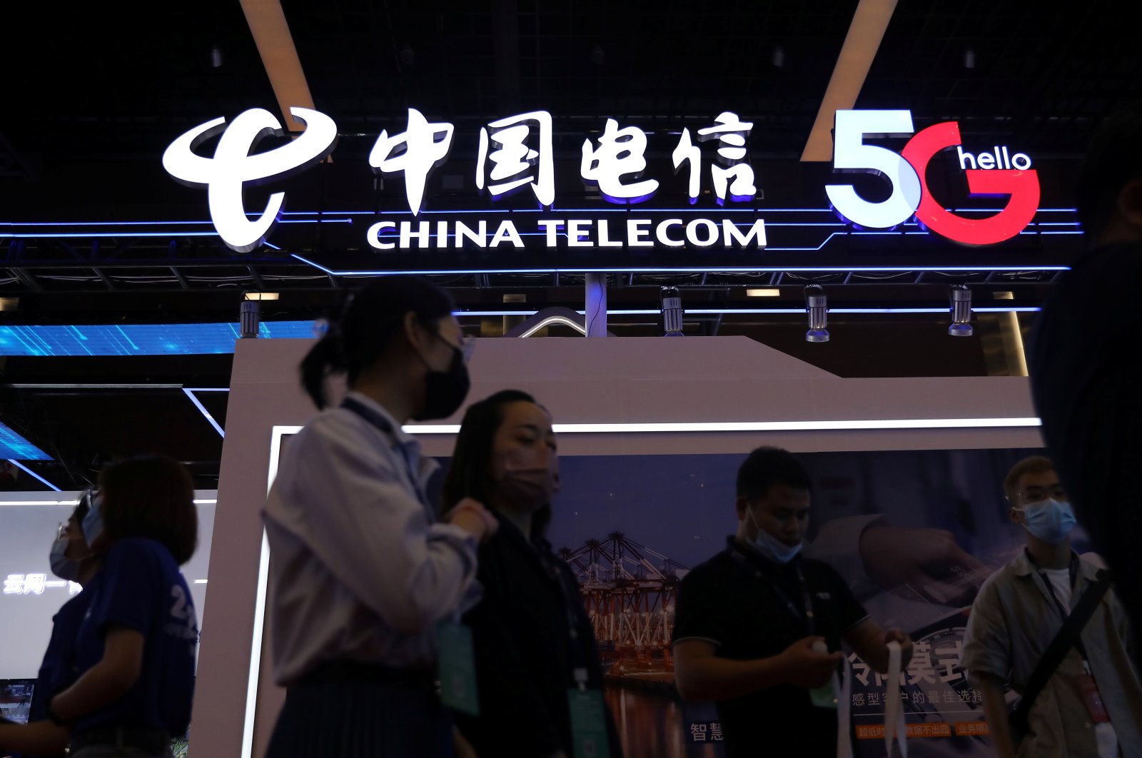 People are seen at a China Telecom booth at an exhibition during China Internet Conference in Beijing, China, July 13, 2021. (Reuters Photo)