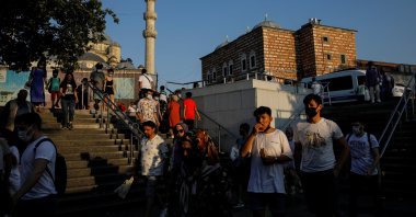 People walk along the Eminönü neighborhood in Istanbul, Turkey, July 12, 2021. (Reuters Photo)