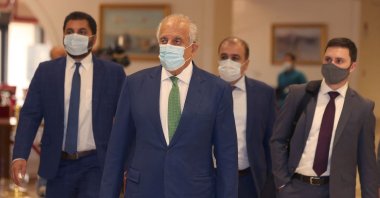 U.S. special envoy for Afghanistan, Zalmay Khalilzad (2nd L), arrives at a hotel for an international meeting on the escalating conflict in Afghanistan, in Doha, Qatar, Aug. 10, 2021. (AFP Photo)