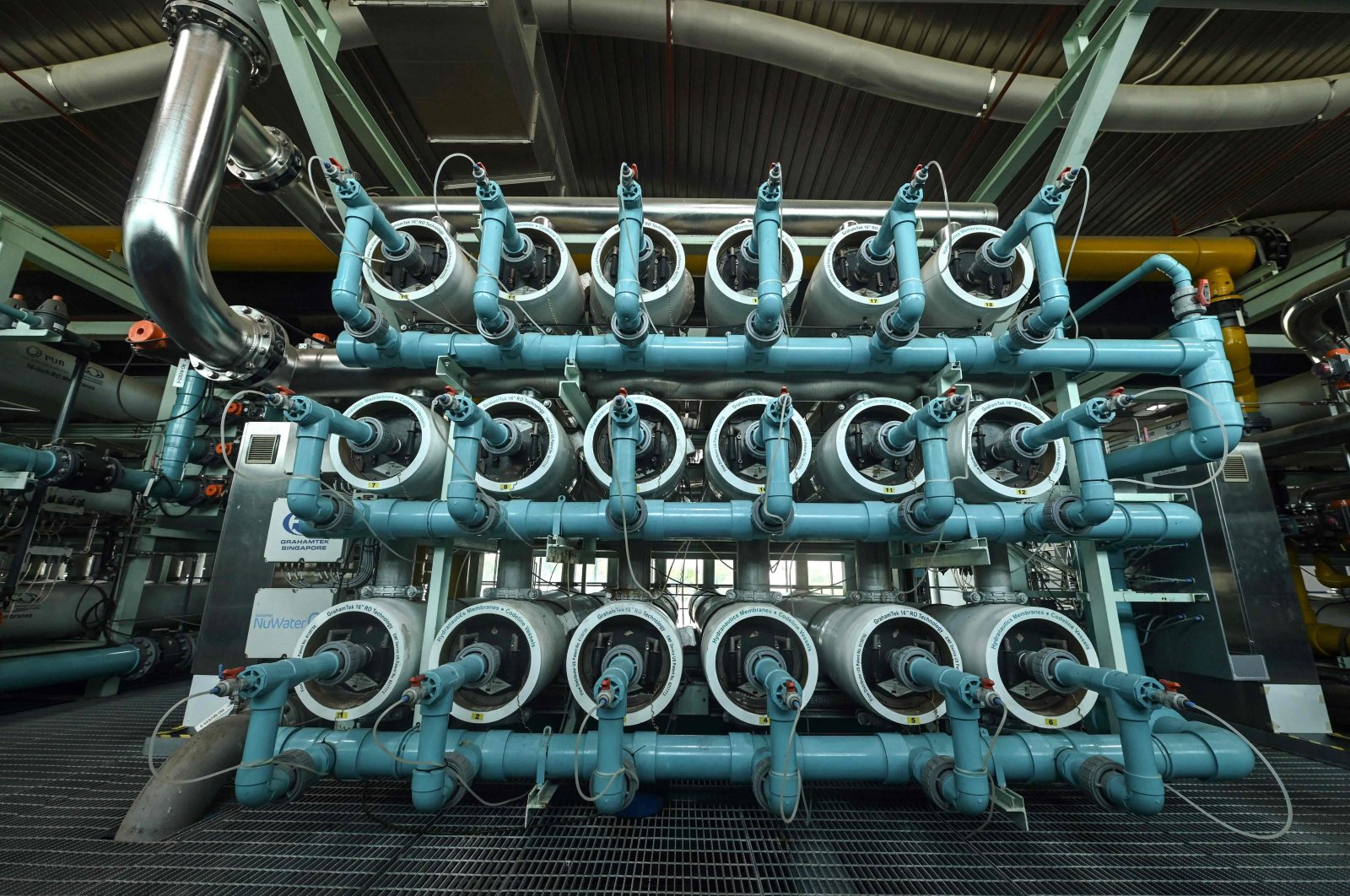 This picture shows the reverse osmosis treatment on used water equipment at the Bedok NEWater plant in Singapore,  July 27, 2021. (AFP Photo)