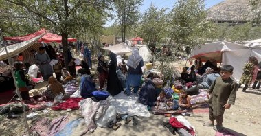 Afghan migrants, who left their homes due to the clashes between Afghan government forces and the Taliban, survive under difficult conditions in a park with makeshift tents they set up in the capital, Kabul, Afghanistan, on Aug. 8, 2021. (AA Photo)