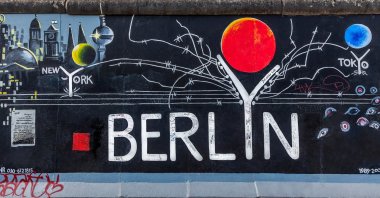 Various graffiti marking different cities can be seen on a part of the original Berlin Wall at East Side Gallery, Berlin, Germany, Sept. 15, 2014. (Shutterstock Photo)