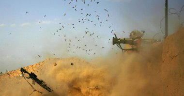 US army soldier with the 101st Airborne Division Alpha Battery 1-320th fires an AT-4 as Combat Outpost Nolen on the outskirts of the village of Jellawar in the Arghandab Valley came under Taliban attack, September 11, 2010. (AFP Photo)