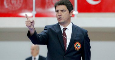 Turkish karate referee Uğur Kobaş gestures during a match in this undated photo. (DHA Photo)