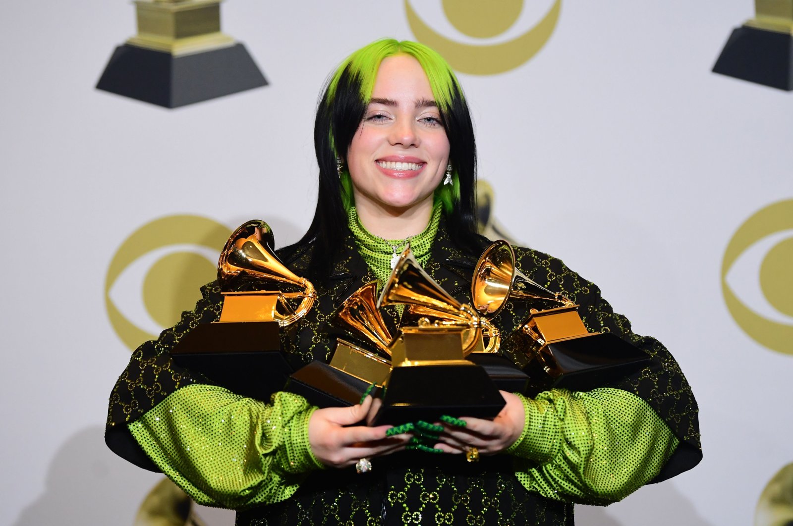 American singer-songwriter Billie Eilish poses in the press room with the awards she won during the 62nd Annual Grammy Awards in Los Angeles, CA, U.S., on Jan. 26, 2020. (AFP Photo)
