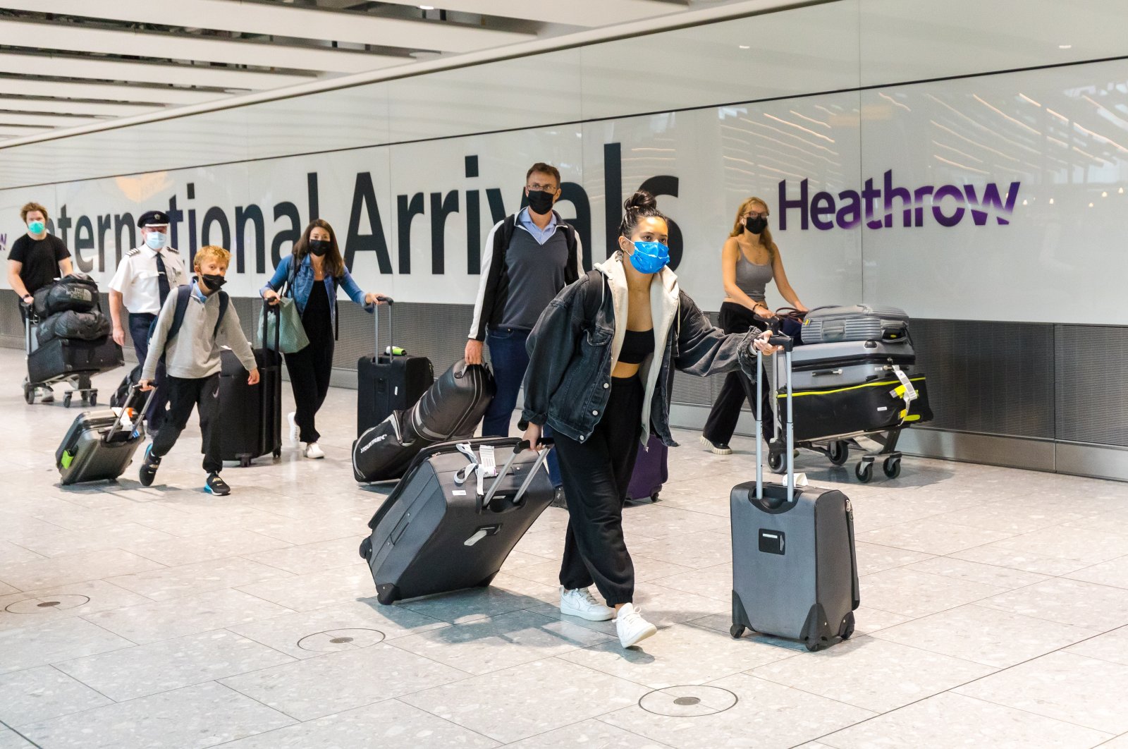 Passengers arrive at Heathrow Airport in London, U.K., Aug. 2, 2021. (EPA Photo)
