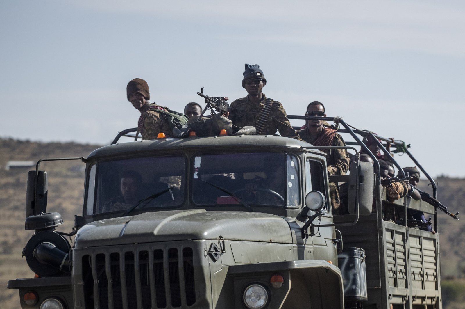Ethiopian government soldiers ride in the back of a truck on a road near Agula, north of Mekele, in the Tigray region of northern Ethiopia on May 8, 2021. (AP Photo)