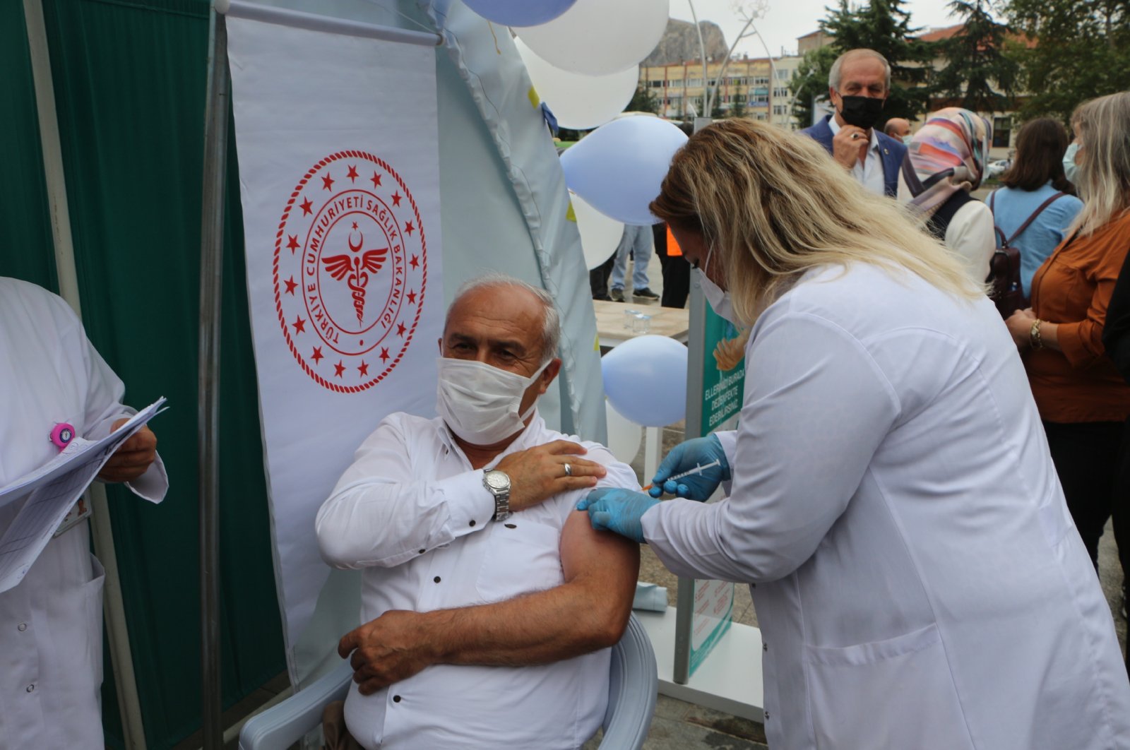 A man is vaccinated outside a vaccination tent, in Tokat, northern Turkey, Aug. 11, 2021. (DHA Photo)