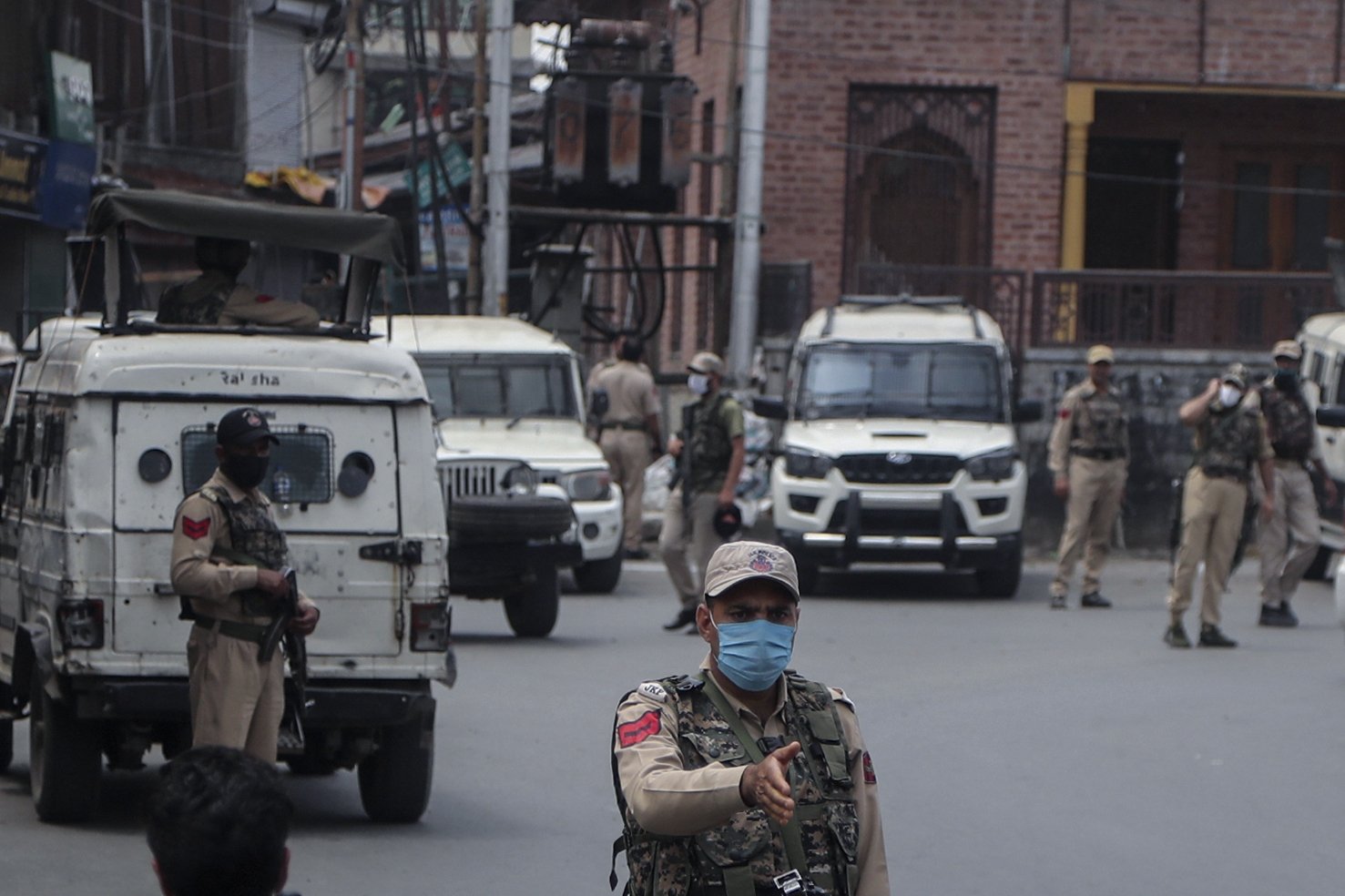 Indian police officers guard a closed market during a strike on the second anniversary of India’s revocation of the disputed region’s semi-autonomy in Srinagar, Indian-controlled Kashmir, Aug. 5, 2021. (AP Photo)