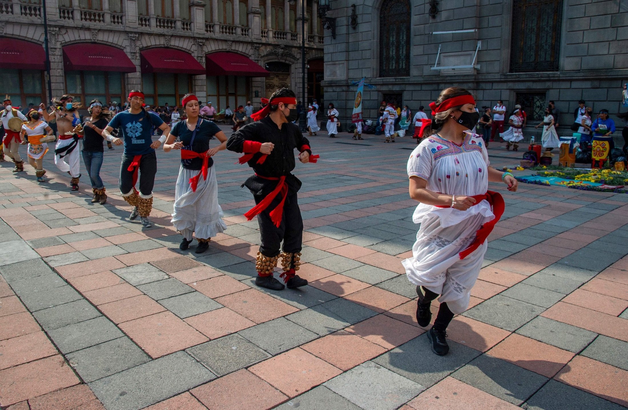 People perform an Aztec dance at the historical Center in Mexico City, Mexico, Aug. 3, 2021. (AFP Photo)