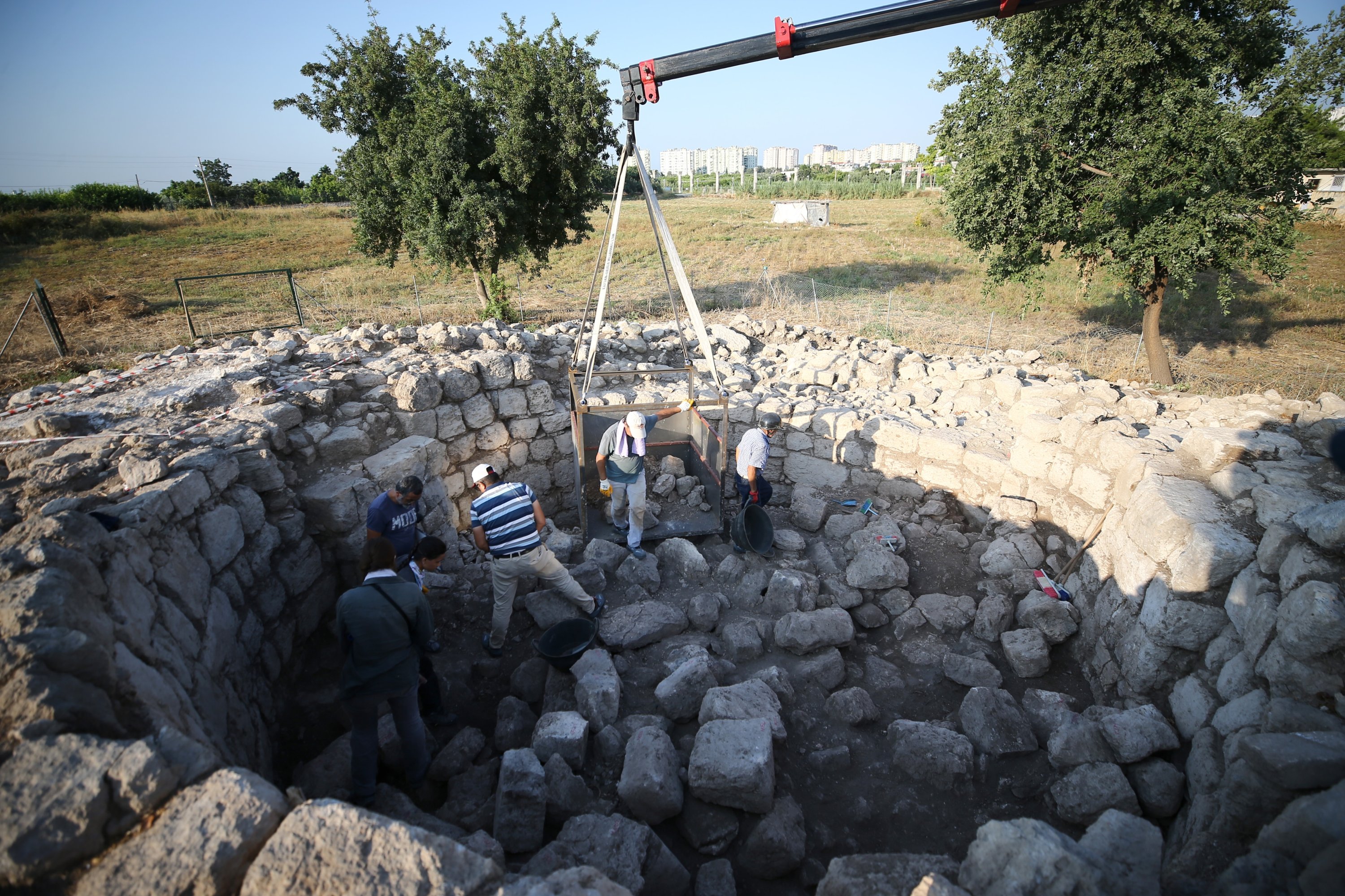 Archaeologists work on the area of the memorial tomb of Aratus in the ancient city of Soli‐Pompeiopolis, Mersin, southern Turkey, August 12, 2021. (AA Photo) 