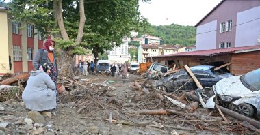People inspect the debris and destruction caused by floods in the Bozkurt district of Kastamonu province, northern Turkey, Aug. 12, 2021. (İHA PHOTO)