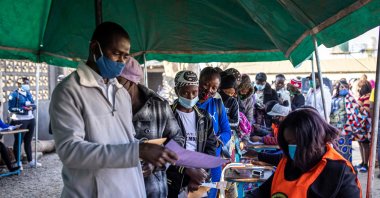 People queue at a polling station as Zambians elect their next president after a tense campaign, Lusaka, Zambia, Aug. 12, 2021. (AFP Photo)