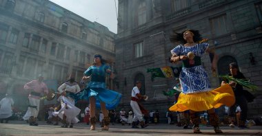 People perform an Aztec dance at the historical Center in Mexico City, Mexico, Aug. 3, 2021. (AFP Photo)