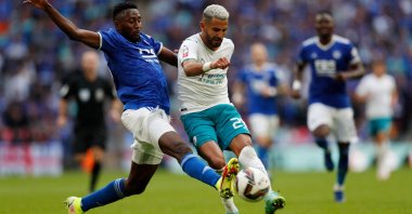 Manchester City's Algerian midfielder Riyad Mahrez (R) tries to shoot past Leicester City's Wilfred Ndidi (L) during the English FA Community Shield match at Wembley Stadium, London, England, Aug. 7, 2021. (AFP Photo)