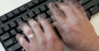 A person types on a computer keyboard, in Washington, D.C., U.S., Nov. 21, 2016. (AFP Photo)