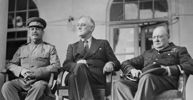 Soviet Union leader Josef Stalin (L), U.S. President Franklin Roosevelt (C) and U.K. Prime Minister Winston Churchill confer in the Soviet Embassy during the Tehran Conference, Tehran, Iran, Dec. 7, 1943. (Getty Images)
