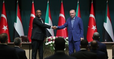 President Recep Tayyip Erdoğan (R) shakes hands with Abdel Fattah al-Burhan, the chairperson of Sudan’s Sovereign Council, following their meeting in the capital Ankara, Turkey, Aug. 12, 2021. (AA Photo)