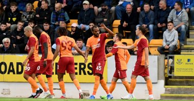 Galatasaray players celebrate after scoring a goal at Scotland's McDiarmid Park during the UEFA Europa League third qualifying round, Aug. 12, 2021 (AA Photo)