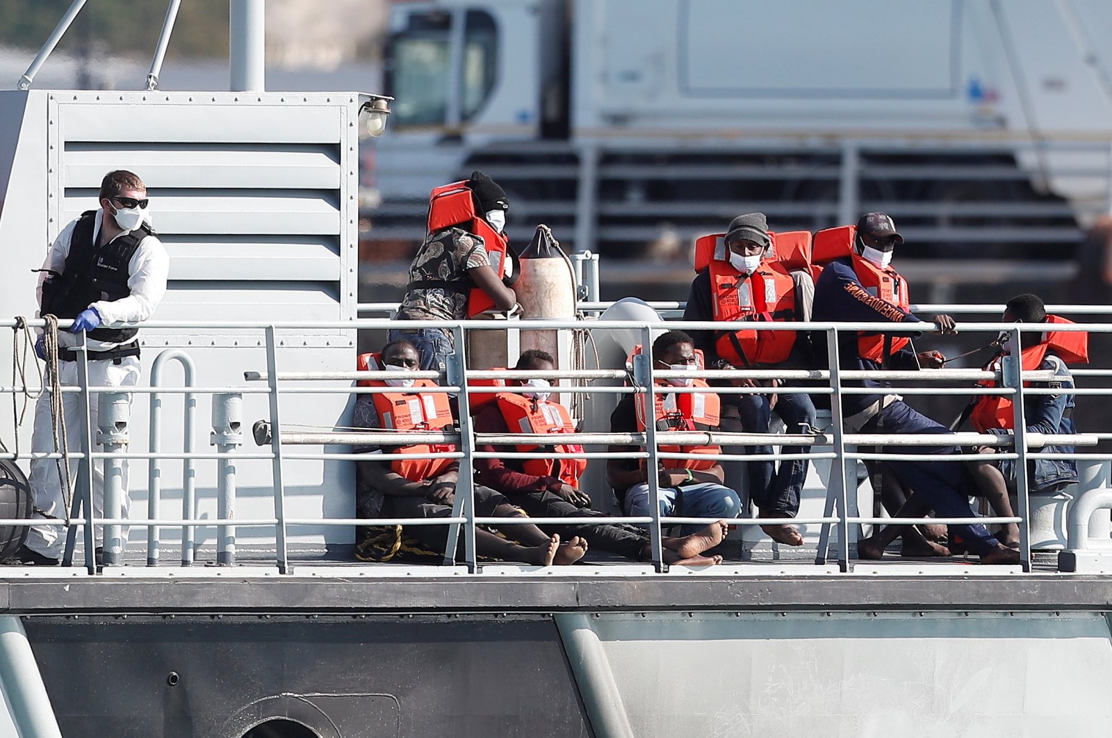 Migrants claiming to be from Darfur, Sudan sit on a Border Force vessel after being rescued as they crossed the English Channel in an inflatable boat near Dover, Britain, August 4, 2021. (Reuters Photo)