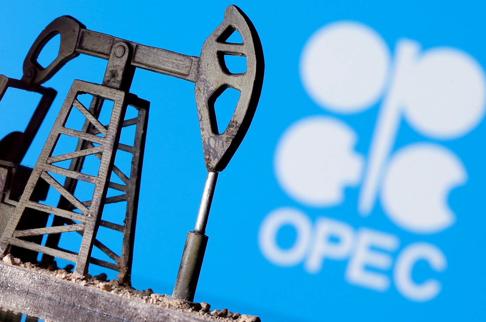 A 3D-printed oil pump jack is seen in front of displayed OPEC logo in this illustration picture, April 14, 2020. (Reuters Photo)