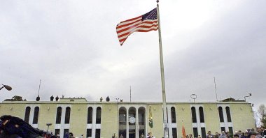 The American flag flutters after it was raised at the opening ceremony of the U.S. Embassy in the Afghani capital of Kabul, Afghanistan, Dec. 17, 2001. (AFP File Photo)