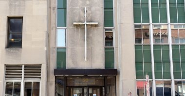 A man walks by the offices of the Diocese of Rockville Centre, on New York's Long Island, New York, U.S., Oct. 1, 2020. (AP Photo)