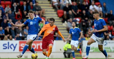 Galatasaray' Kerem Aktürkoğlu (C) in action against St. Johnstone's Jamie Daniel McCart (L), in Perth, Scotland, Aug. 12, 2021. (AA PHOTO) 