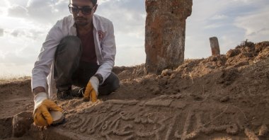 Member of the excavation team carries out archaeological work at an unidentified Seljuk grave's sanduka, a type of traditional cenotaph, in Bitlis, Turkey, Aug. 13, 2021. (AA Photo)